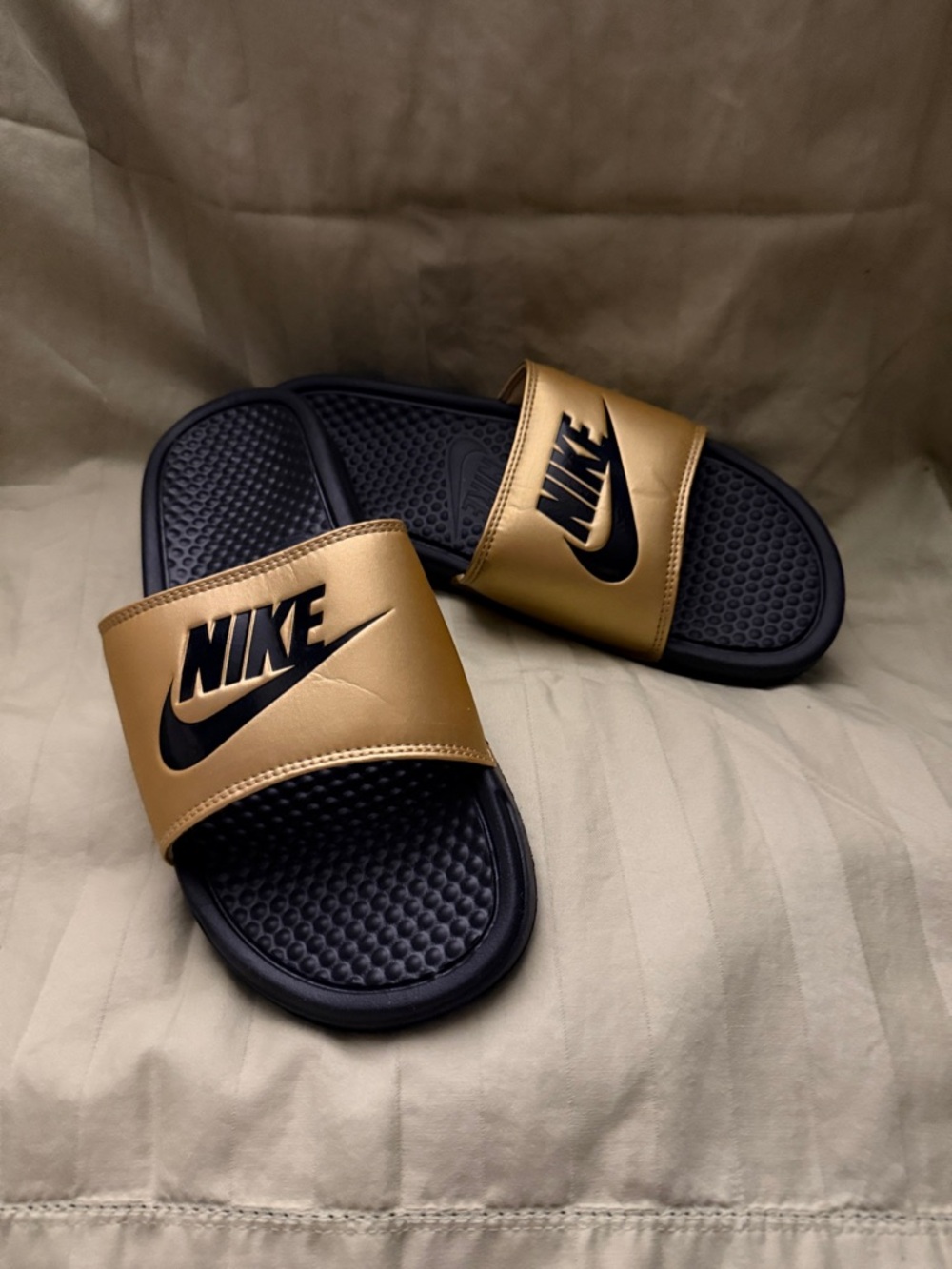 Nike Women's Black and Gold Slide Sandals